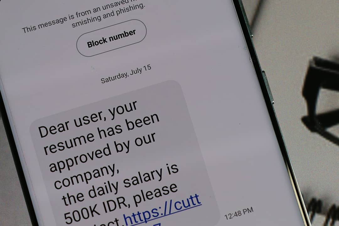 A suspicious job alert text message with a phishing link.